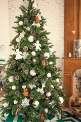 2019 happy New Year set stock red knitted Mittens with wooden numbers 2019 against red paper background. empty copy space for inscription. colorful sweet confetti