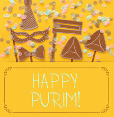 Purim celebration concept (jewish carnival holiday). Traditional symbols shapes cutted from paper.