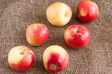apples scattered on burlap