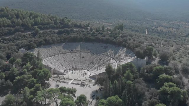 Panning from right to left showing the front of the ancient theather of Epidavros in Greece. Clear sky, sunny weather, flat colour profile.