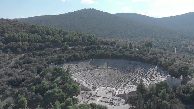 Panning from right to left showing the front of the ancient theather of Epidavros in Greece. Clear sky, sunny weather, flat colour profile.