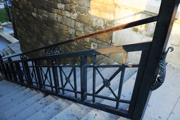 Stone staircase with iron handrail
