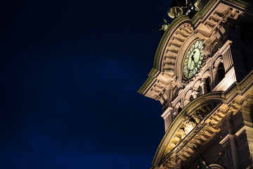 detail of a neoclassic building with a original clock