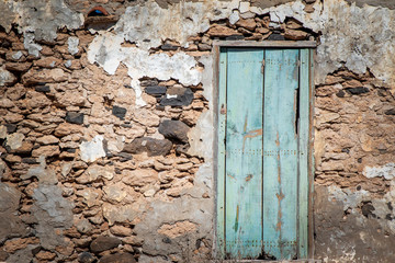 Old stone wall and wooden door