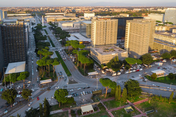 Fototapeta premium Aerial view of the modern EUR district in Rome, built for the Universal Exposition that should have been held in the Capital in 1942. In the foreground the small lake and the neighborhood park