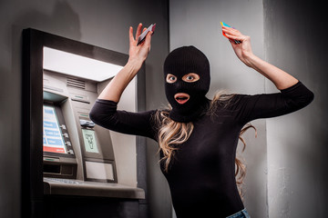 female thief robs an ATM