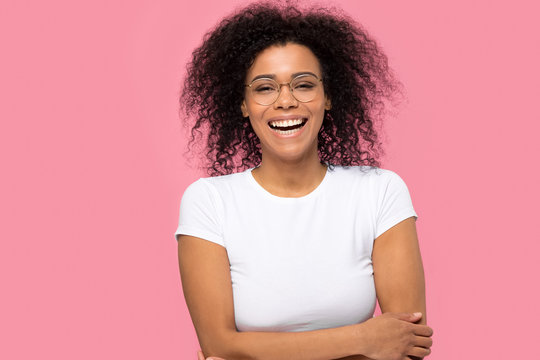 Portrait Of Joyful Black Woman Laughing Isolated On Pink Background