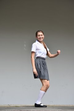 Cute Colombian Teen Girl And Happiness Wearing Skirt Standing