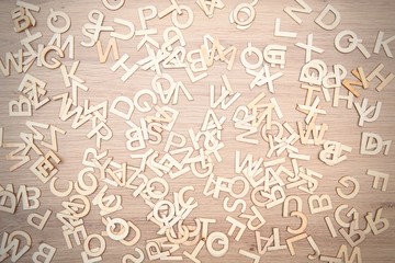 Texture made of wooden letters. Wooden background.