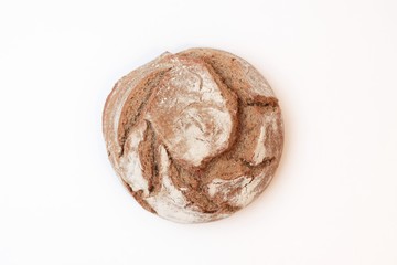 loaf of bread from the top, white background, soft light