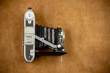 Top view of vintage camera on colorful background