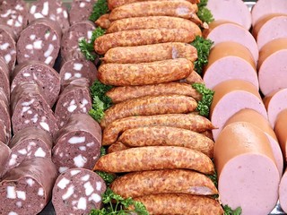 Fresh sausages on a party plate