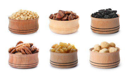 Set of bowls with healthy dried fruits and tasty nuts on white background