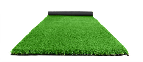 Rolled artificial grass carpet on white background. Exterior element