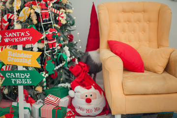 Snowman toy with car on table against blurred background
