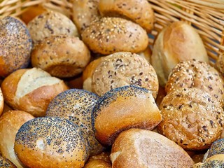 fresh bread rolls or buns in a basket