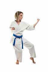 Full body of woman making martial arts pose wearing white outfit