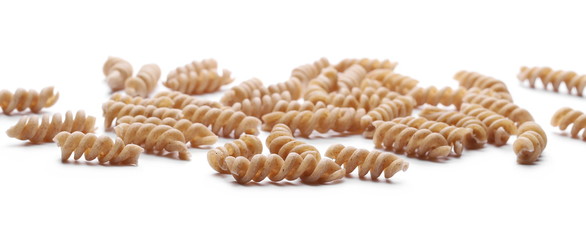 Wholemeal pasta isolated on white background