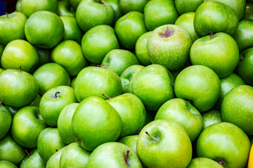 Bunch of green apples in supermarket