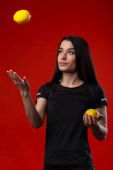 beautiful girl with lemon and apple