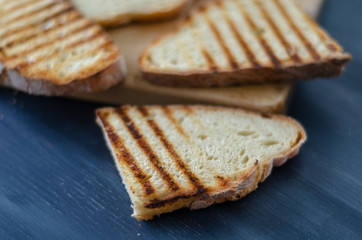 Fresh toasted bread  on wooden background