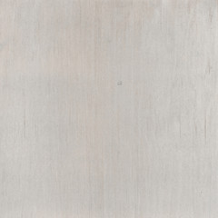 Wood painted white worn and scratched background texture. 