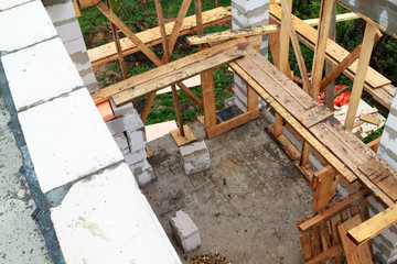 interior of a country house under construction. Site on which the walls are built of gas concrete blocks with wooden formwork