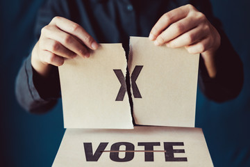 man tear brown paper with x mark above vote box, democracy concept, retro tone