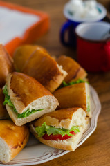 Tasty and fresh sandwiches on a  wooden table