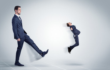 Young businessman fired cruel and aggressive by his boss with white background
