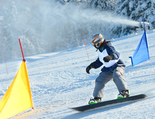 Snowboarders are slalom racer, winter sports