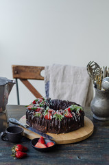 Chocolate cake decorated with strawberries