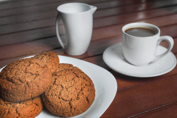 A cup of coffee and cookies