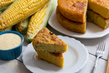 Fresh baked corn bread on wooden background