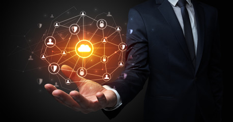 Businessman holding networking connection concept with dark wallpaper