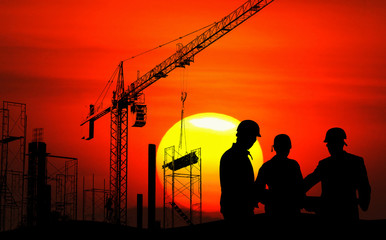 Engineer on site, they are working at building construction area.