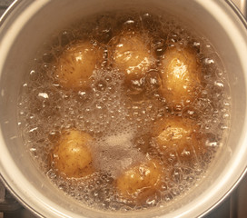 Potatoes are cooked in a pan in the kitchen