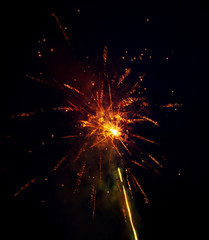 Fototapeta na wymiar Fireworks in the sky at night as a background