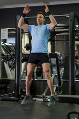 Fototapeta na wymiar Image of a muscular man doing cardio exercises at the gym.