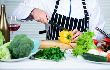 Prepare ingredients for cooking. Useful for significant amount of cooking methods. Basic cooking processes. Man master chef or amateur cooking healthy food. Chop ingredients. According to recipe