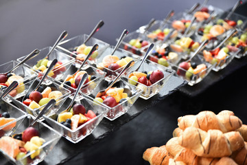 Fruit salad in small glass bowls. Luxury catering for an event.