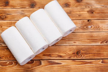 Roll of paper towel on wooden background