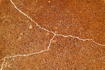 Abstract cracked background as basis for any creative design. Cement, asphalt floor fissure...