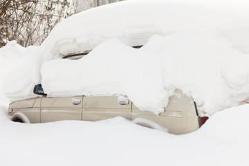 the car was snowed in in a Blizzard