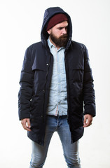 Hipster outfit. Man bearded hipster stand in warm black jacket parka isolated on white. Hipster modern fashion. Guy wear hat and black winter jacket. Stylish and comfortable. Hipster style menswear