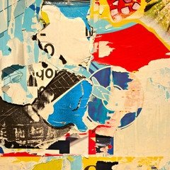 Old grunge ripped torn vintage collage colorful street posters creased crumpled paper surface...