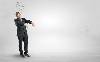 Tired businessman with sleeping sickness going somewhere
