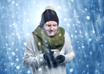 Handsome young boy shivering and trembling at snowstorm concept

