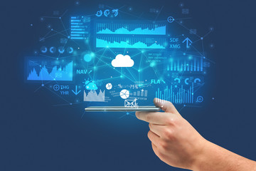 Businessman using phone with flying application icons around
