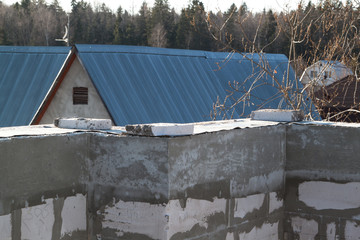 interior of a country house under construction. Site on which the walls are built of gas concrete...